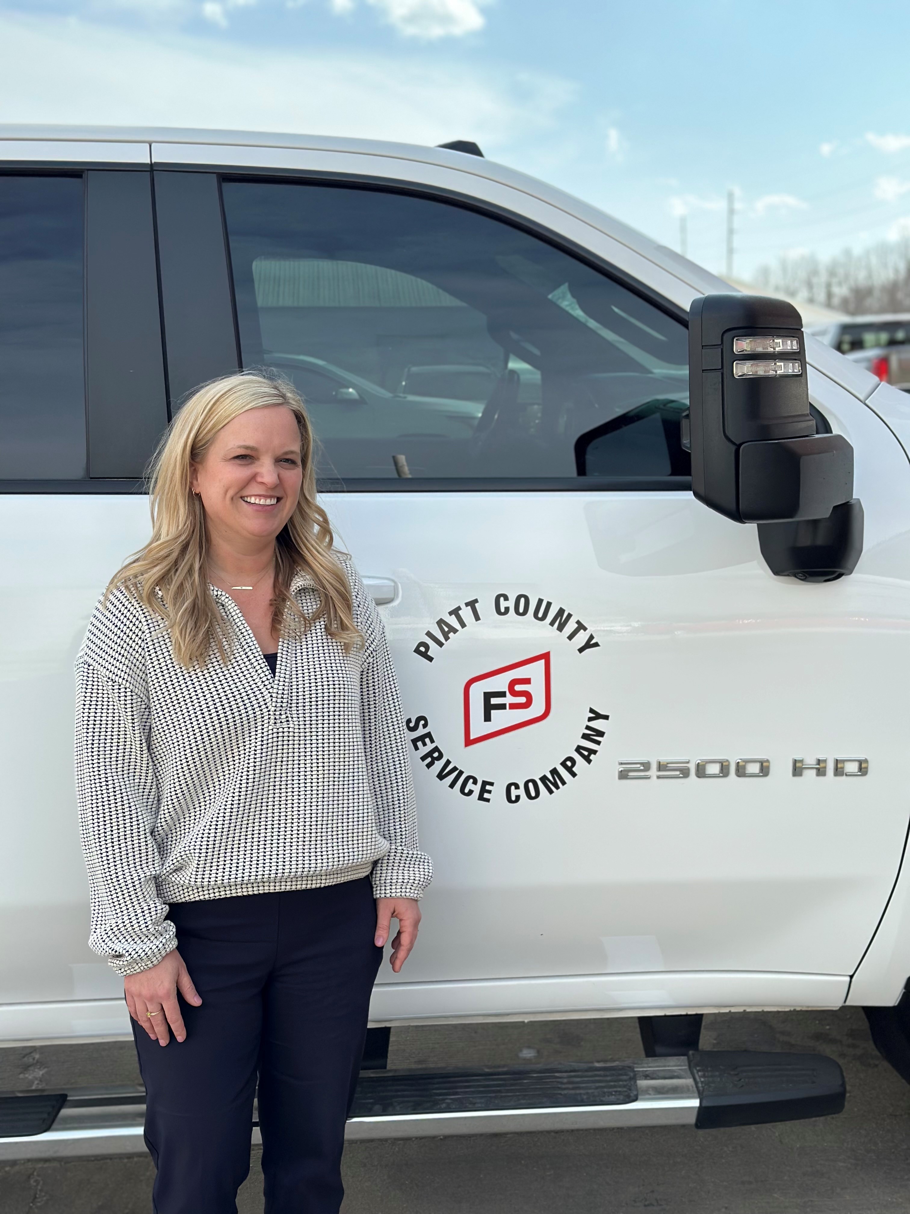 lauren redmon in front of piatt service company truck